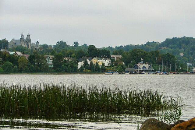 The Newport waterfront seen across Lake Memphremagog, with the town rising behind the shoreline