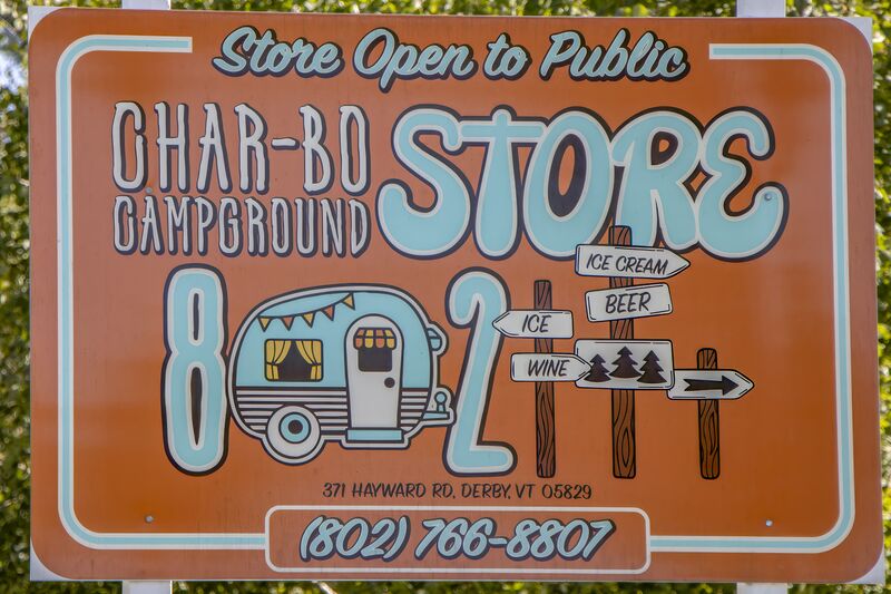The painted roadside sign for the camp store, open to the public